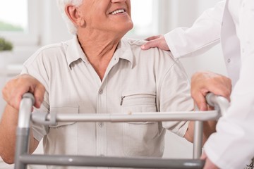 Wall Mural - Senior man with walking zimmer