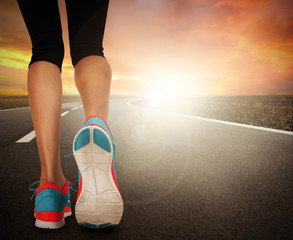 Wall Mural - Runner feet running on road