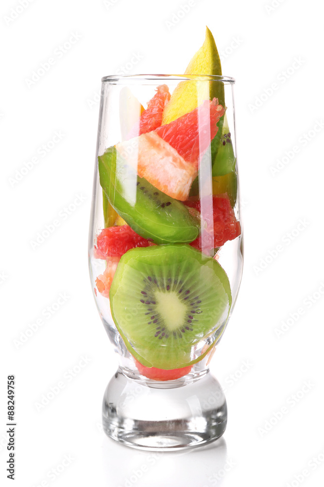 Fresh fruits salad in glass isolated on white