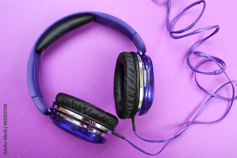 Headphones on purple background