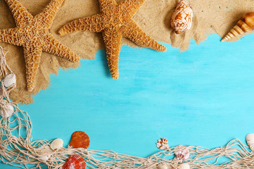 Wall Mural - Sand and seashells with sand on wooden background