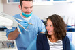 © Production Perig - Young attractive woman being cured by a dentist