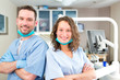 © Production Perig - Portrait of a young attractive dentist and his assistant in his