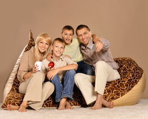 Poster - Family sitting on  armchair with tea