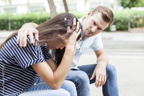 Side View Of A Man Comforting A Sad Caucasian Girl Mourning Buy