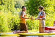 Woman and man with stand up paddle board sup on river