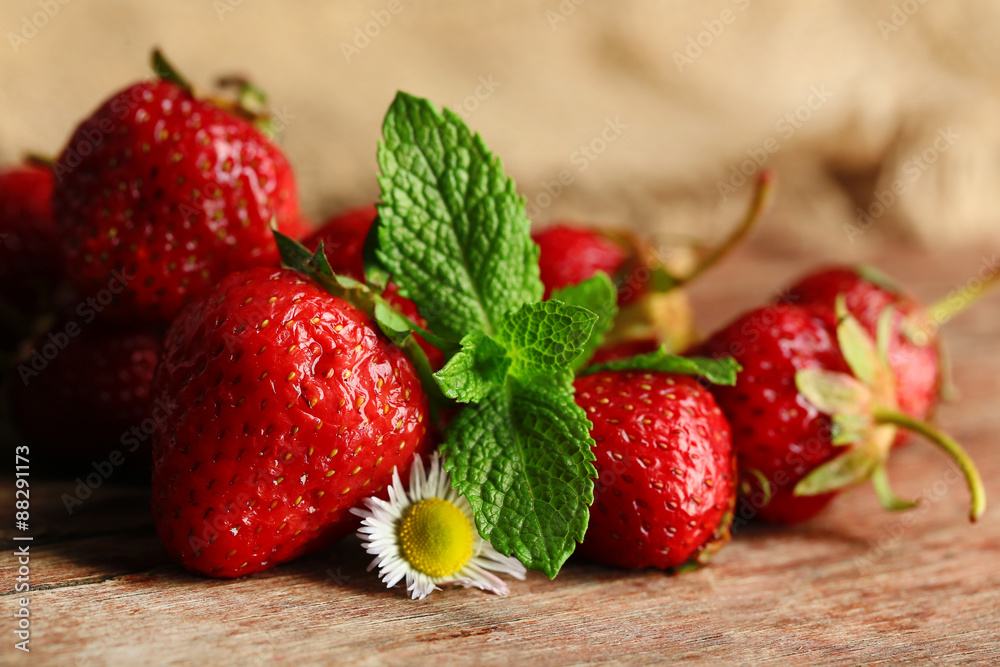 Red ripe strawberries, on wooden background
