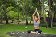 © chayathon2000 - Young woman doing yoga exercises in the garden park