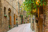 Fototapeta  - Alley in old town San Gimignano Tuscany Italy
