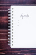 Concept of agenda record,notebook on wooden background