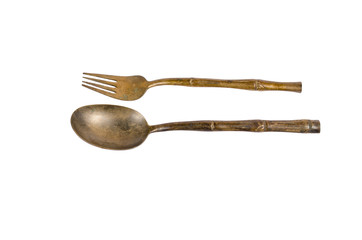 old brass spoon and fork isolated on white background