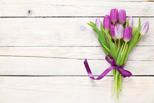 Purple Tulips Over Wooden Table