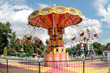 Orange carousel in an empty amusement park in late summer