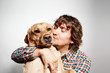 © WHstudio Leushin N - Closeup portrait handsome young hipster man, kissing his dog