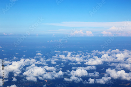 Plakat na zamówienie Skyline View above the Clouds from air plane