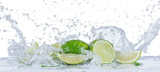 Fresh limes with water splashes