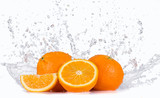 Fototapeta Kuchnia - Fresh oranges with water splashes.