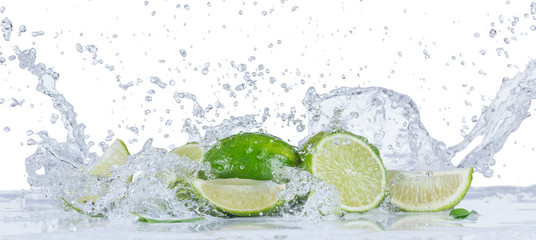 Wall Mural - Fresh limes with water splashes