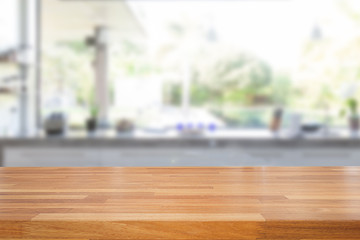 Empty wooden table and blurred kitchen background