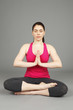 © DW labs Incorporated - A young woman with eyes closed in meditation.