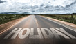 © gustavofrazao - Holiday written on rural road