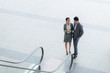 © DragonImages - Talking businessman and businesswoman
