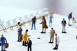 © everythingpossible - close up of miniature people with social network diagram on open