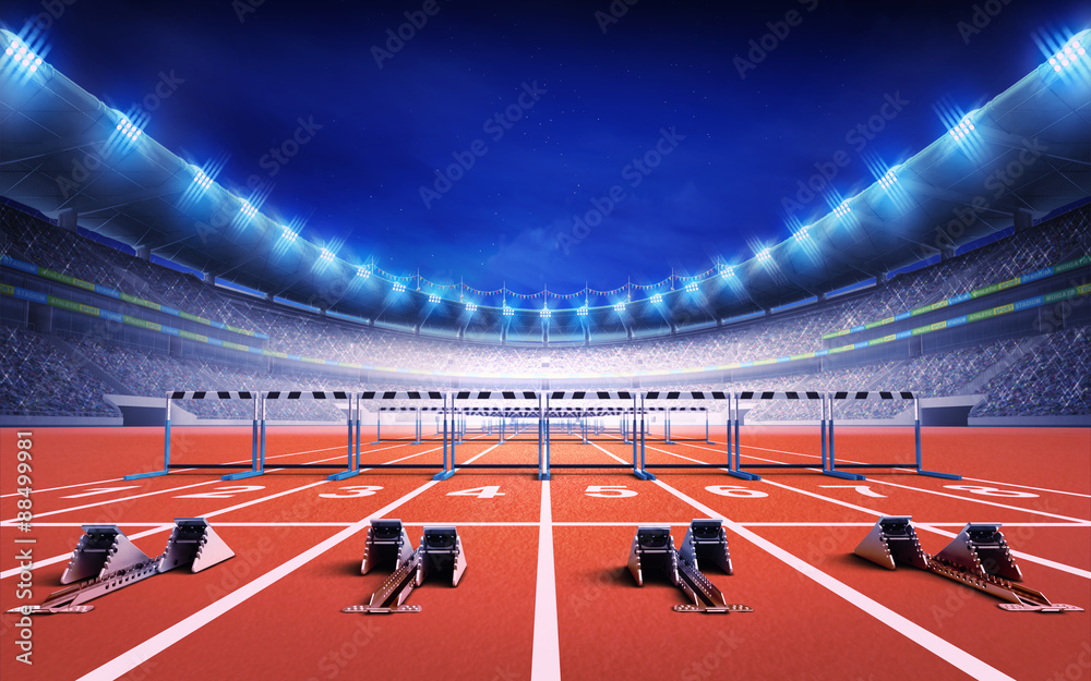 athletics stadium with race track with starting blocks and hurdles ...