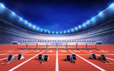 athletics stadium with race track with starting blocks and hurdles
