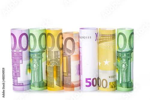 Fotografie, Obraz Billetes de euro enrollados aislados sobre fondo blanco con espacio para texto y