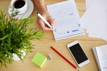 Woman sketching design, top view