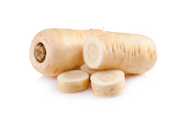 Fresh parsnip roots on a white background