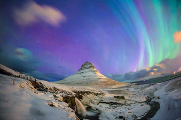 spectacular northern lights appear over mount kirkjufell