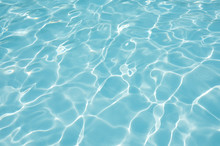 Blue Water Rippled Background In Swimming Pool