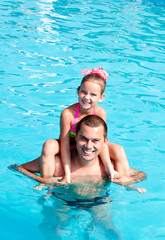 Father and little girl having fun on vacation