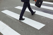 © pressmaster - Businessman crossing road