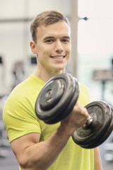 Sticker - smiling man with dumbbell in gym