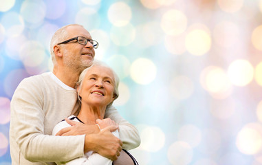 Poster - happy senior couple over holidays lights