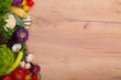 Vegetables on wood background with space for text