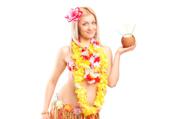 Canvas Print - Woman holding an exotic cocktail in a coconut