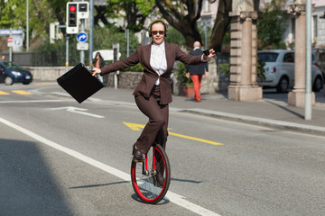 businesswoman with unicycle