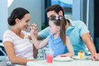 © WavebreakmediaMicro - A family eating at the restaurant