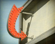 © jdoms - aged and worn vintage photo of neon arrow sign
