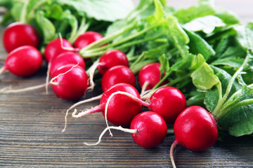 Fresh red radish on wooden table, closeup