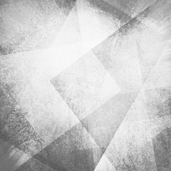 abstract gray background with white faded grunge rectangle shapes layered in random angled patterns