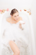 © stormy - Lovely woman in bath with foam having fun