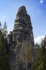 Naklejka na meble Sandstone cliffs for climbing in green forest
