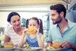 © WavebreakmediaMicro - A family eating at the restaurant