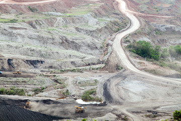 Part of a pit with big mining truck working