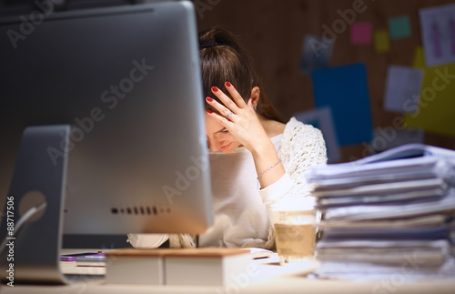 Fotografía Young and beautiful businesswoman tired from work in the office
